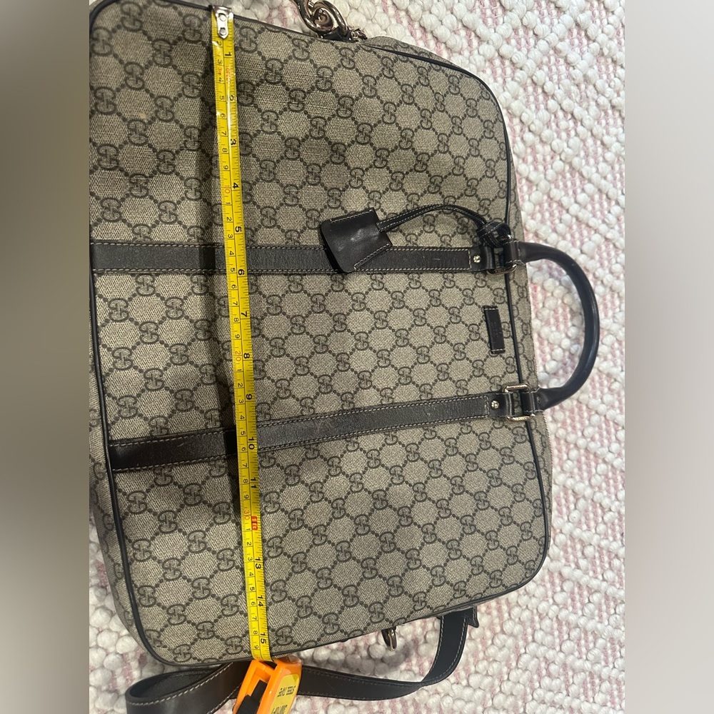 Gucci Supreme laptop bag.